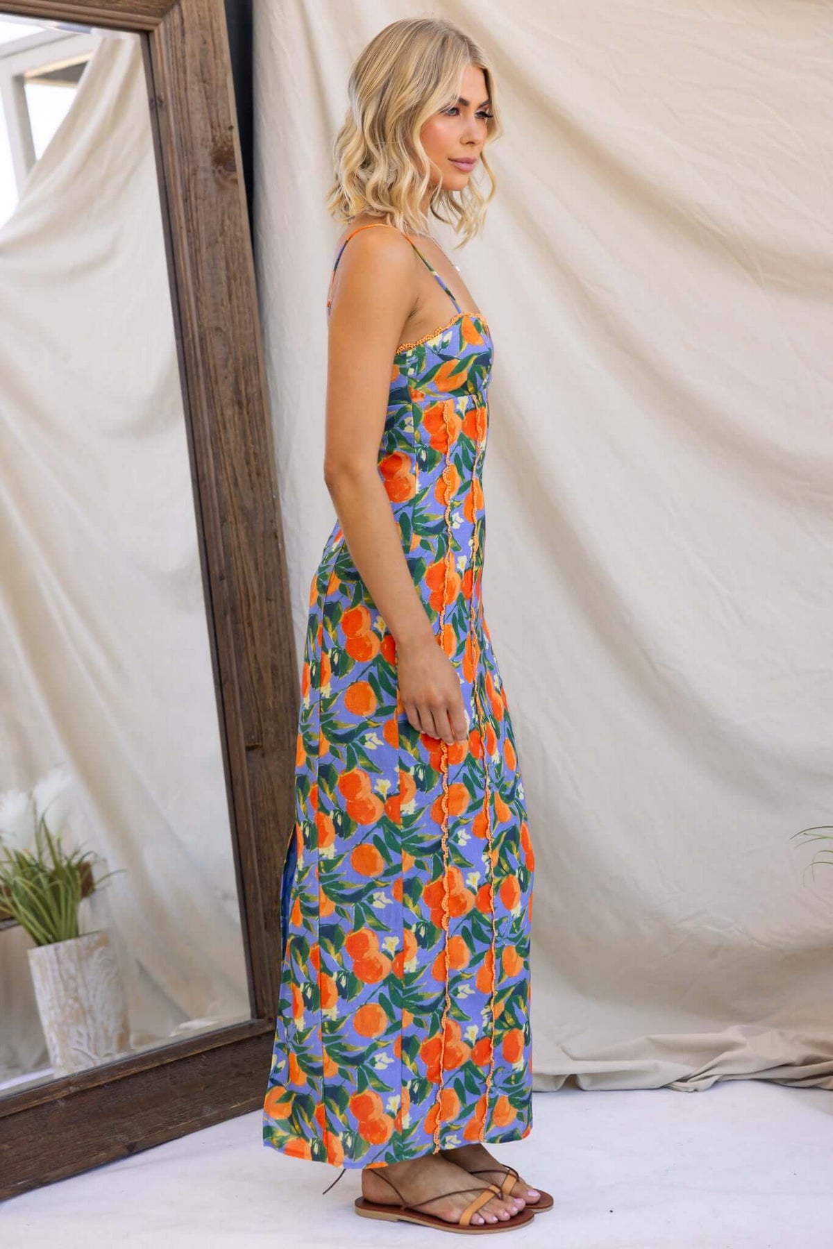Umeeka Maxi Dress featuring adjustable straps and vibrant floral print, suitable for summer outings.