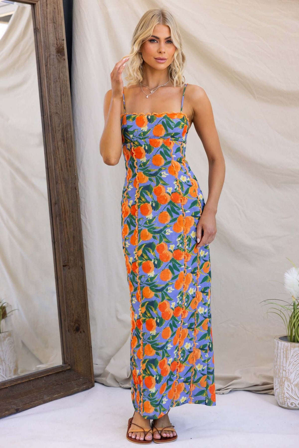 Umeeka Maxi Dress with adjustable straps and back split, featuring a vibrant floral pattern and standard fit.