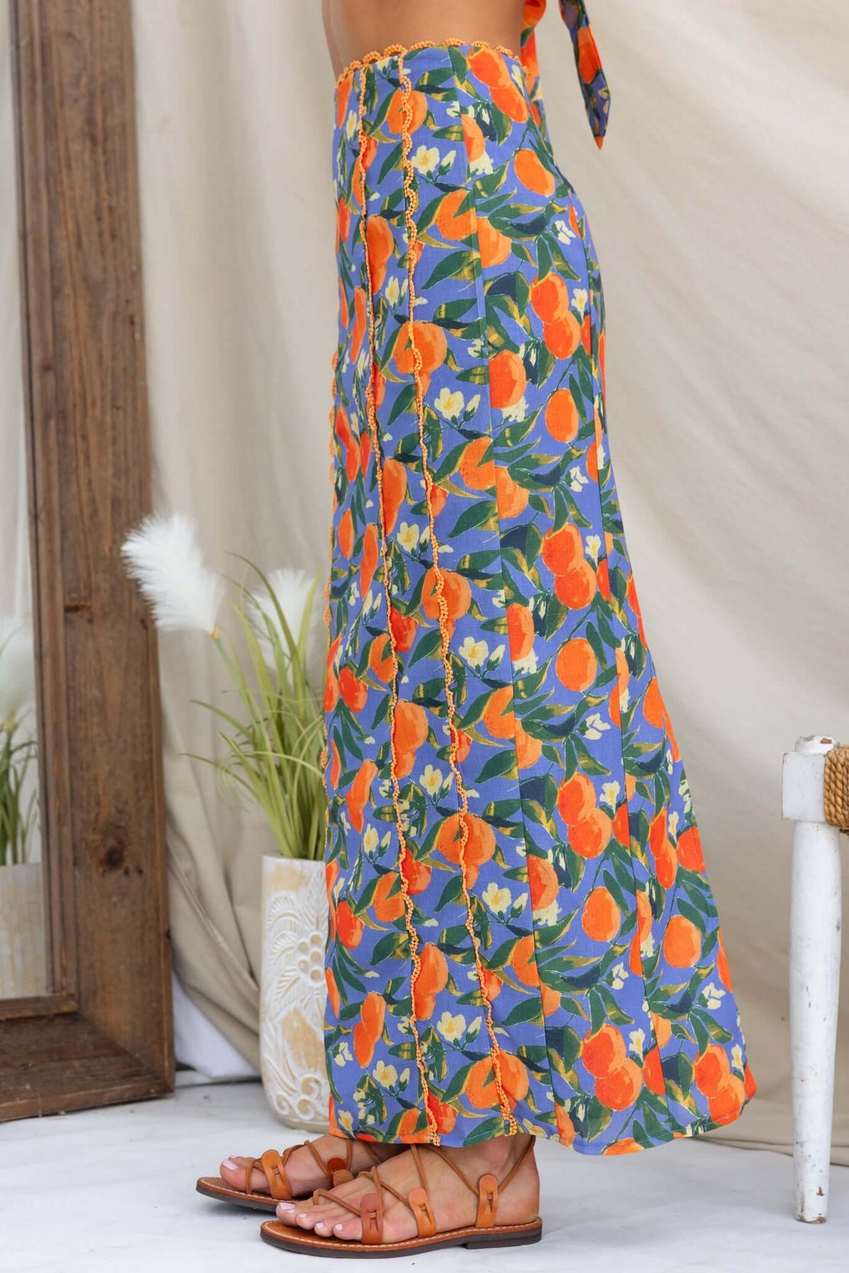 Umeeka Maxi Skirt featuring vibrant floral pattern, mid-high waist, and back split detail, perfect for summer styling.