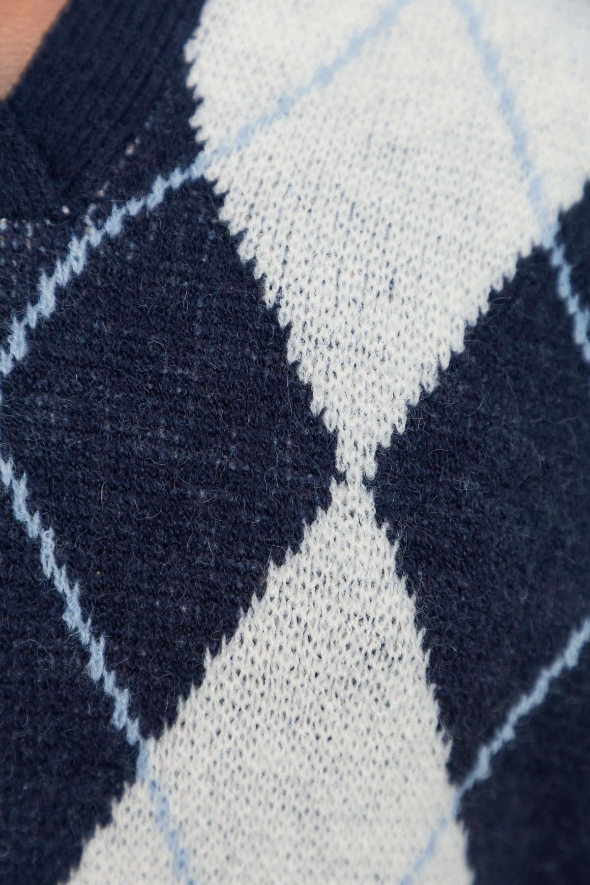 Vella Jumper close-up showing navy and white knit pattern with diamond design.