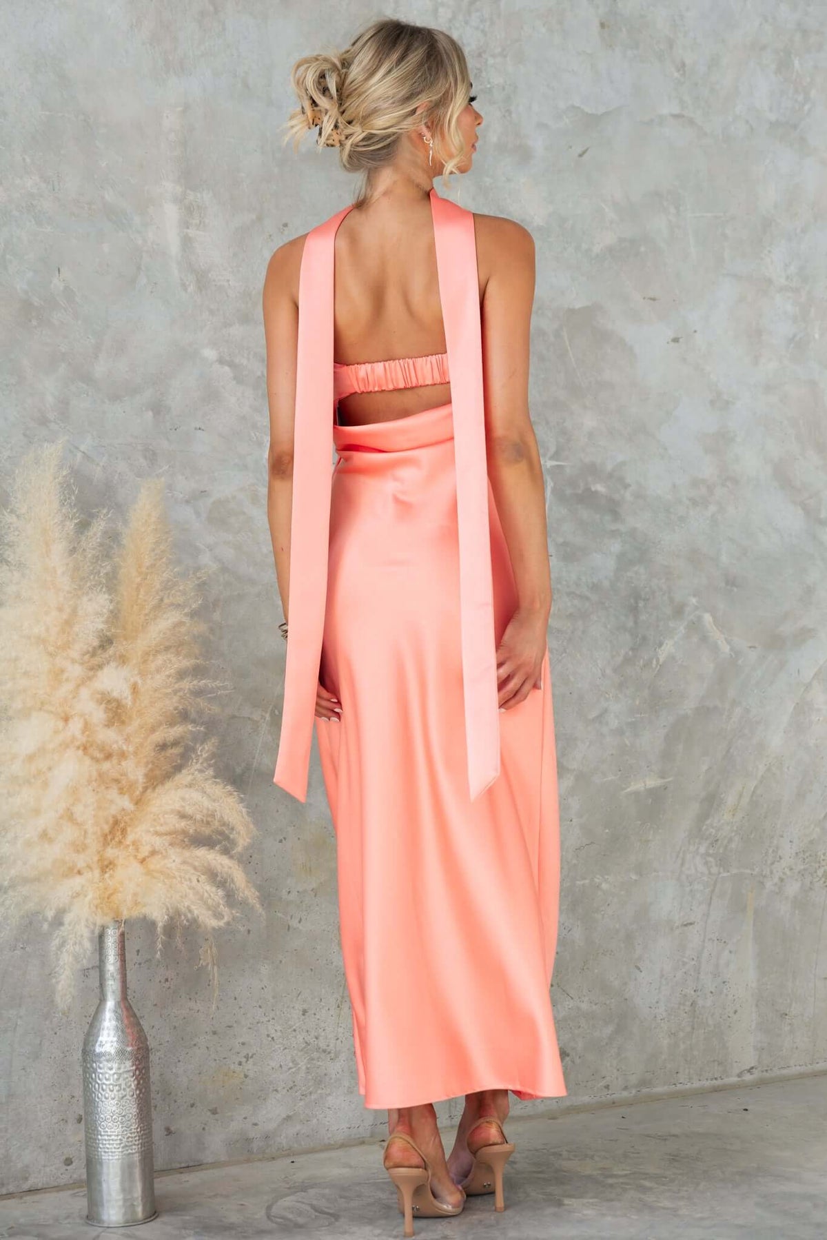 Verda Maxi Dress in soft coral, showcasing strapless design with removable tie and elegant back detail.