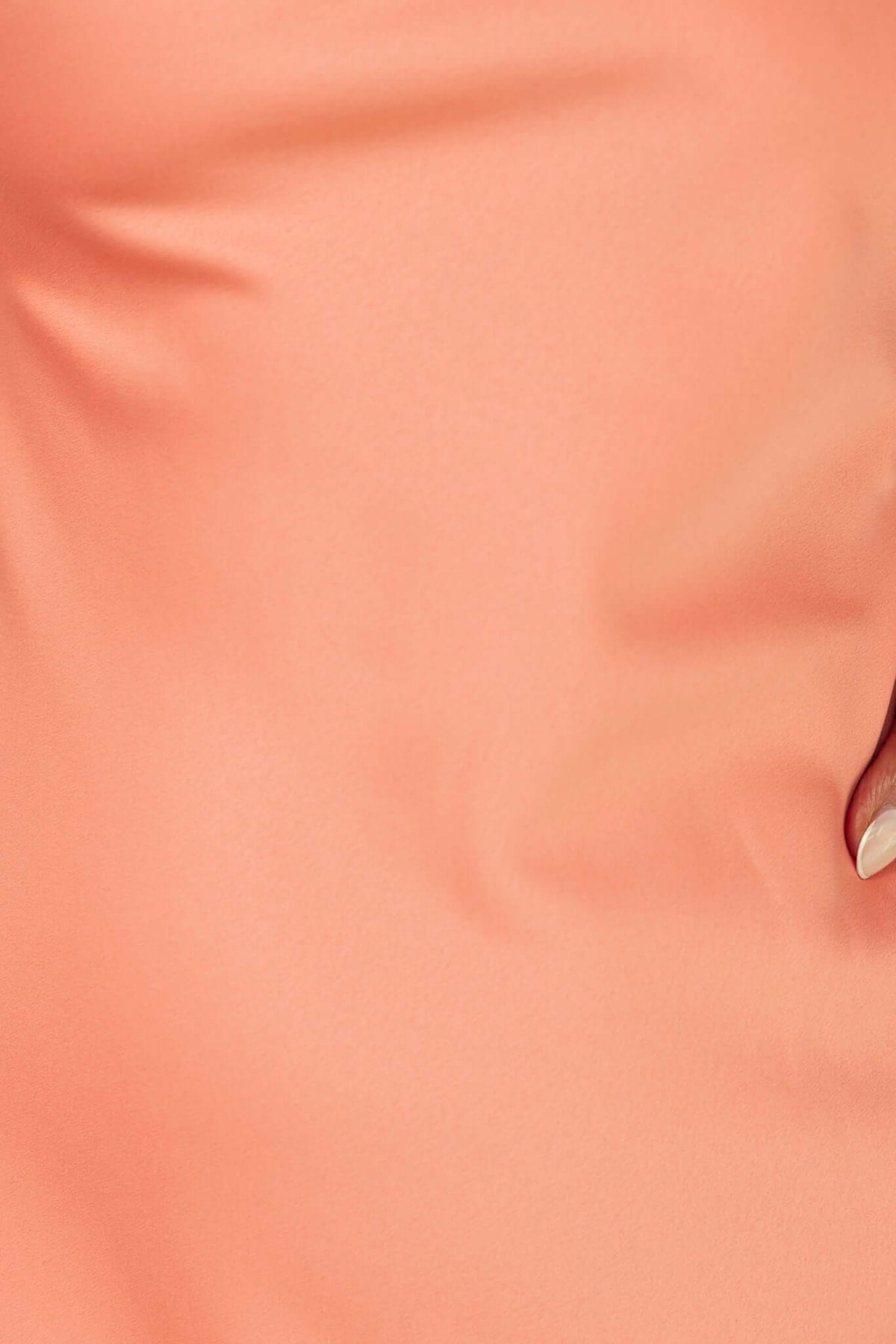 Close-up of smooth peach fabric of Verda Maxi Dress, showcasing strapless design and elegant texture.