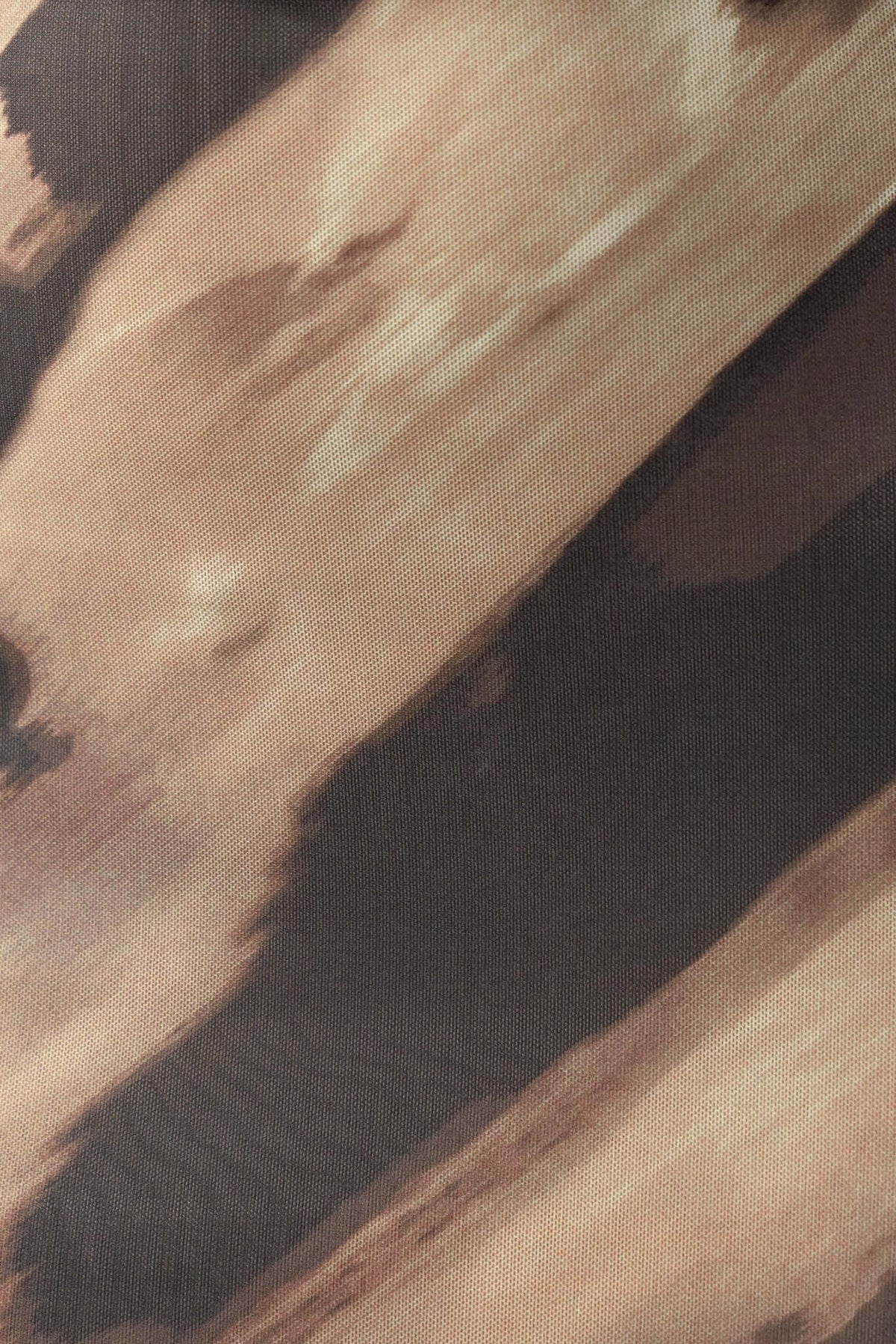 Abstract fabric design with earthy hues of brown and beige, perfect for a stylish maxi dress.