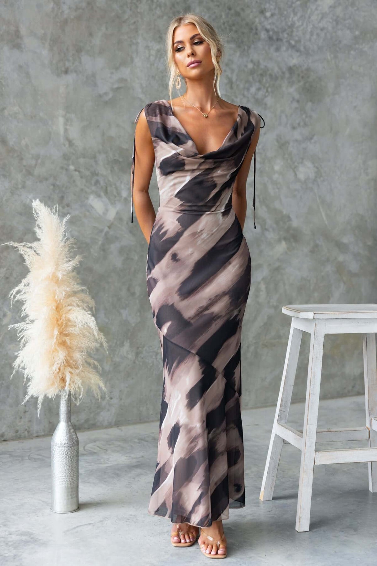 Verone Maxi Dress with cowl neckline and tie straps, featuring a stylish abstract pattern in a slim fit.