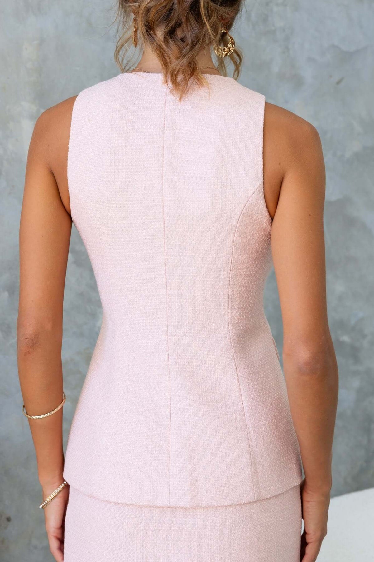 Back view of the Tiffany Top in textured chenille fabric, featuring a fitted design and sleeveless cut.