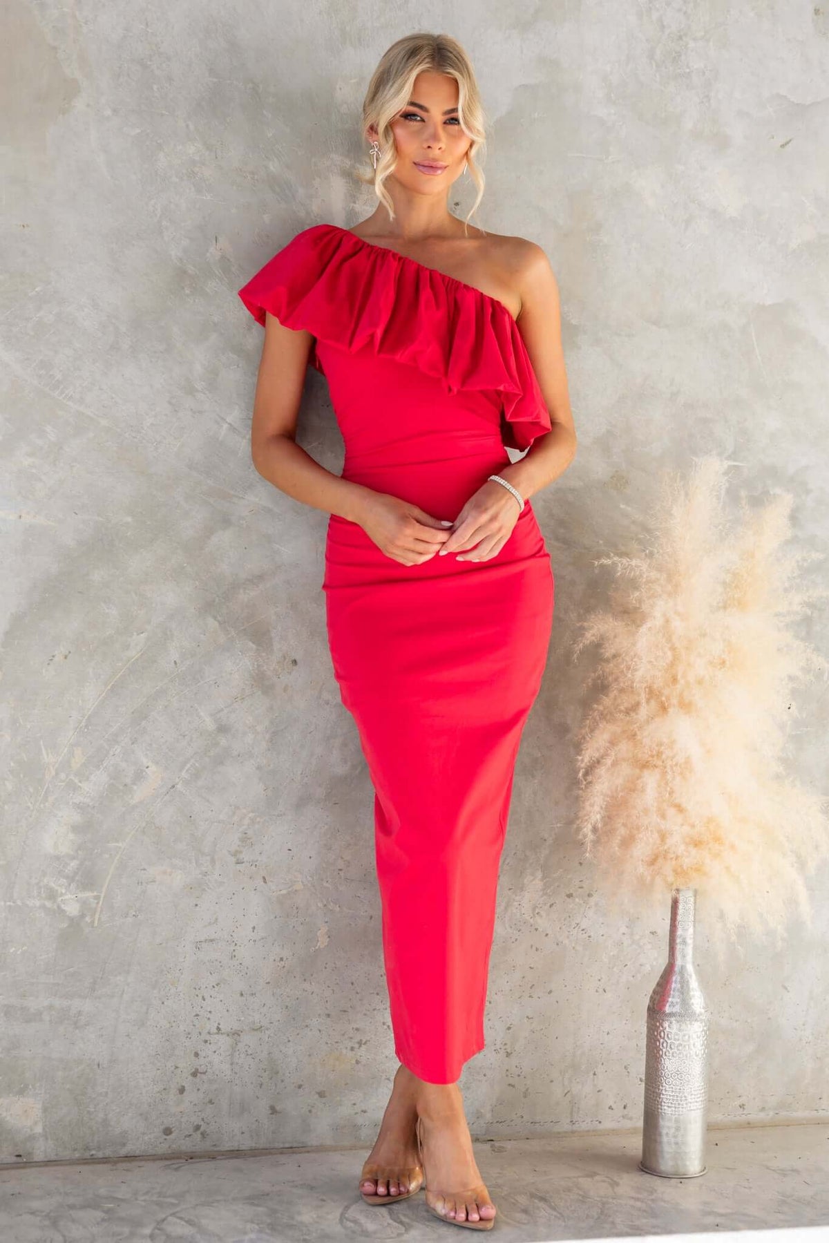 Vitoria Maxi Dress featuring one-shoulder neckline, ruffle detail, and a stylish pink color. Perfect for elegant occasions.