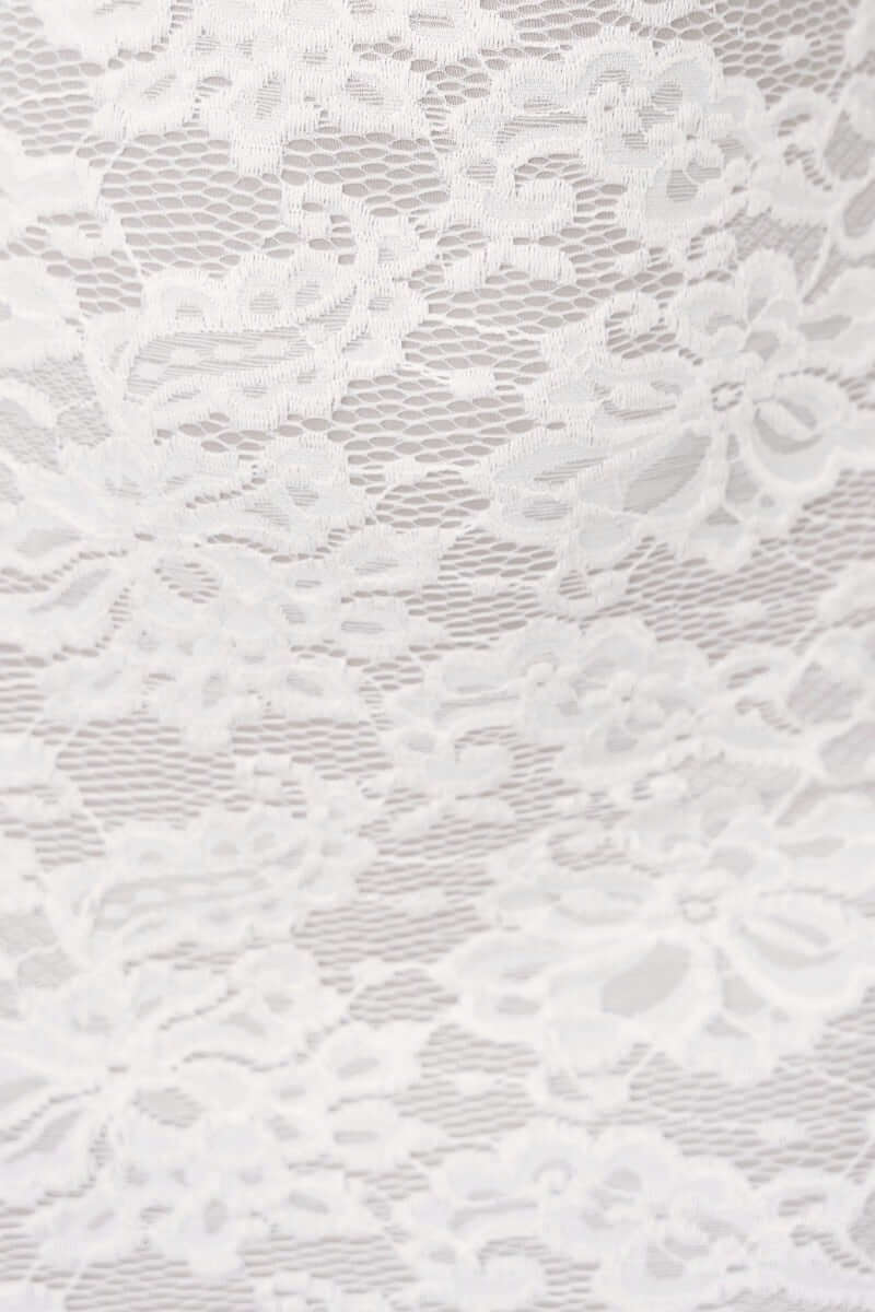 Close-up of delicate white lace fabric with floral patterns, ideal for a lace maxi dress design.