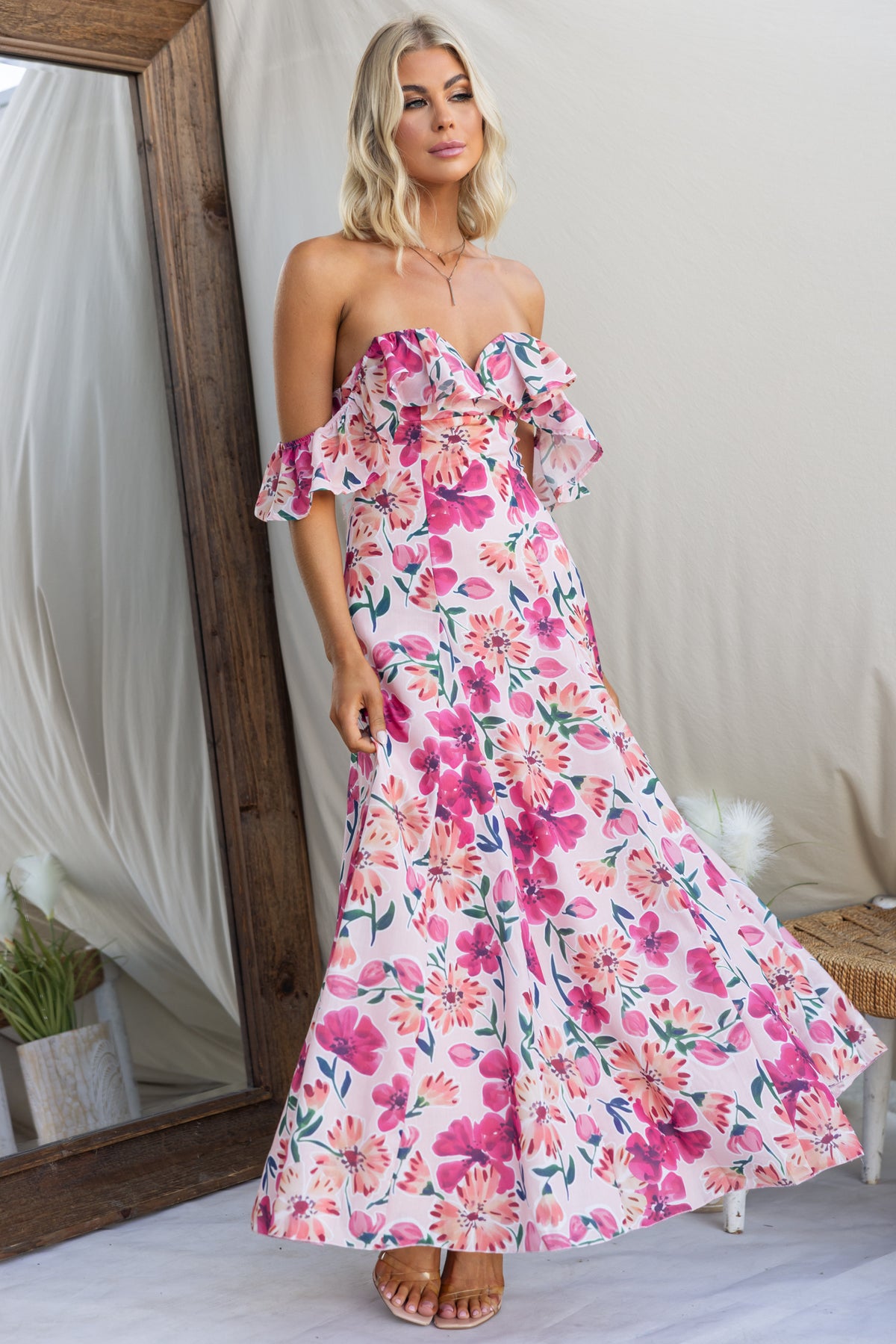 Wilma Maxi Dress featuring floral print, off-the-shoulder sleeves, and wide skirt, perfect for summer occasions.