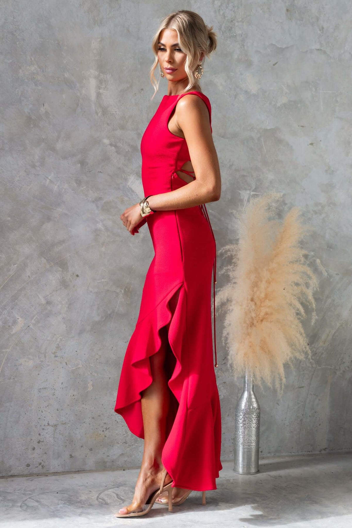 Wyetta Maxi Dress in red with high neckline, ruffled asymmetric hem, and stylish side accent, perfect for any occasion.
