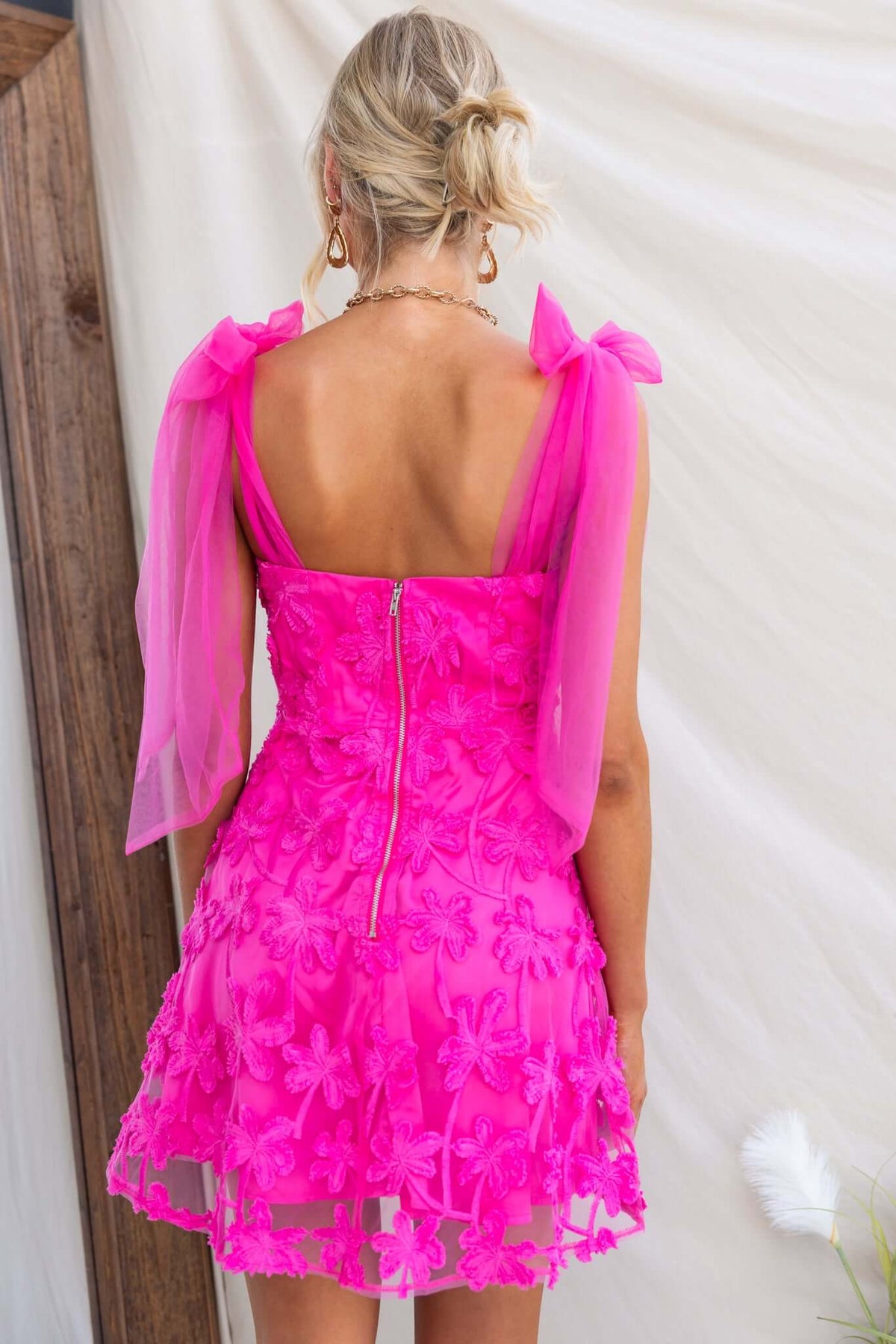Back view of Xaria Dress featuring tie straps, tulle embroidered material, and zip closure.