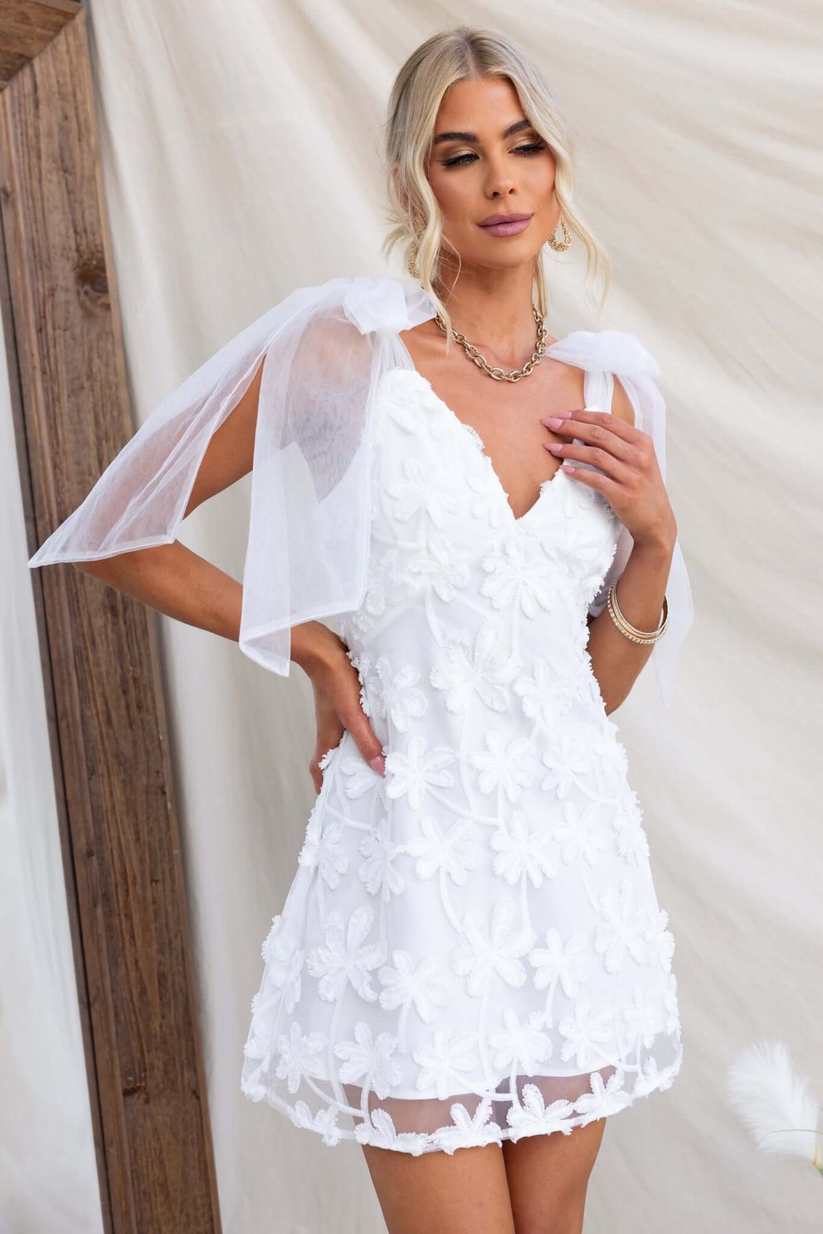Xaria Dress: White tulle embroidered dress with tie straps and back zip, perfect for special occasions.